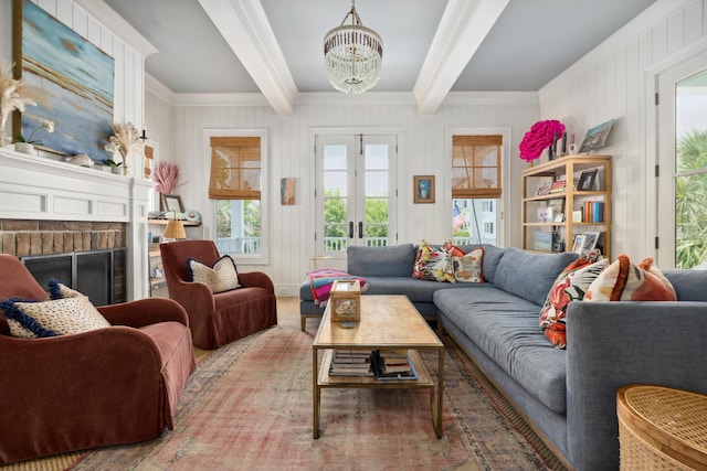 732 Gate Post Dr, Mount Pleasant, SC 29464 - living room with a chandelier, beam ceiling, a fireplace, and french doors