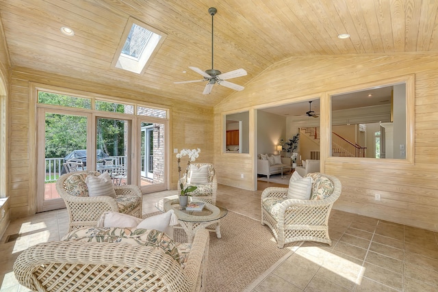 3331 Cottonfield Dr, Mount Pleasant, SC 29466 - living area featuring a ceiling fan, vaulted ceiling, wooden walls, wooden ceiling, and a skylight