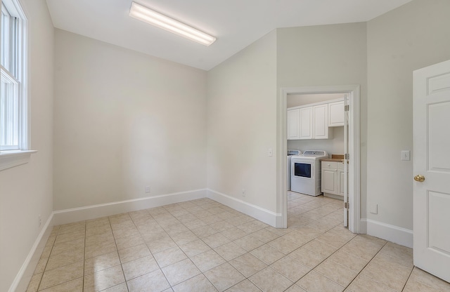 3331 Cottonfield Dr, Mount Pleasant, SC 29466 - empty room featuring washer / clothes dryer, light tile patterned floors, baseboards, and lofted ceiling