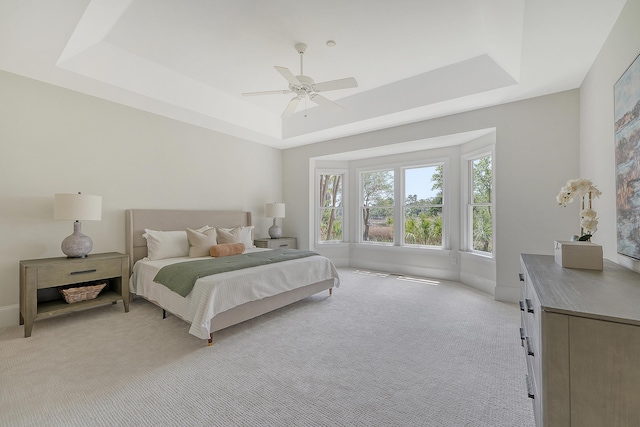3331 Cottonfield Dr, Mount Pleasant, SC 29466 - bedroom featuring a tray ceiling, light colored carpet, ceiling fan, and baseboards