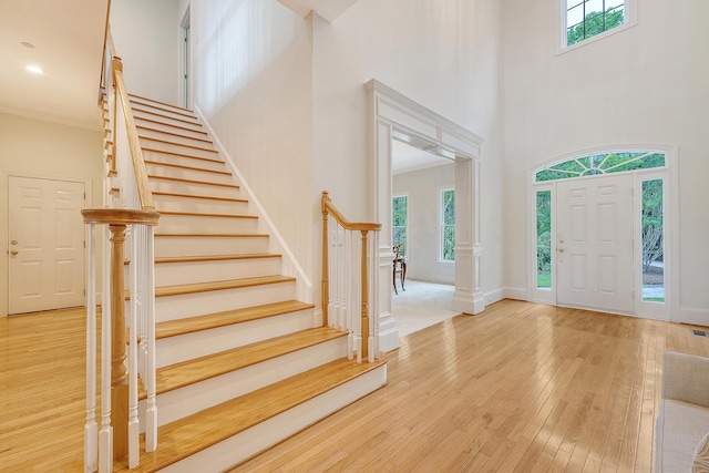 3331 Cottonfield Dr, Mount Pleasant, SC 29466 - foyer with a high ceiling, healthy amount of natural light, stairs, and hardwood / wood-style flooring