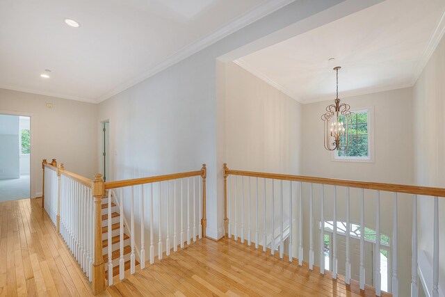 3331 Cottonfield Dr, Mount Pleasant, SC 29466 - corridor with an upstairs landing, hardwood / wood-style floors, a chandelier, ornamental molding, and recessed lighting
