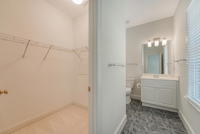 3331 Cottonfield Dr, Mount Pleasant, SC 29466 - bathroom with vanity, toilet, a walk in closet, and healthy amount of natural light