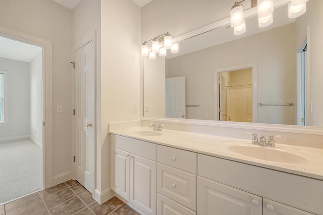 3331 Cottonfield Dr, Mount Pleasant, SC 29466 - bathroom featuring double vanity, tile patterned floors, a shower, and baseboards