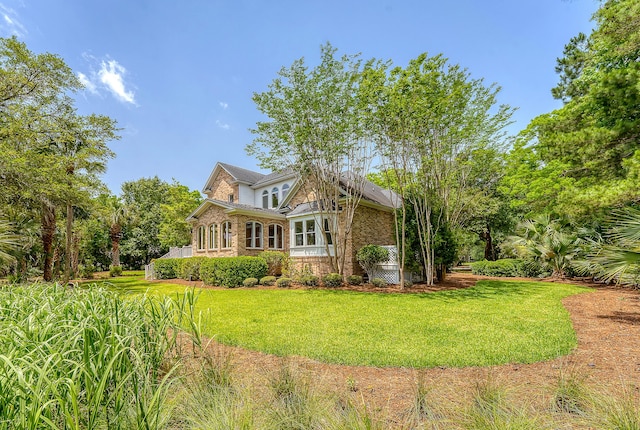 3331 Cottonfield Dr, Mount Pleasant, SC 29466 - back of house featuring a yard, brick siding, and stone siding
