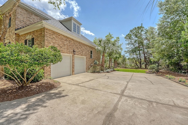 3331 Cottonfield Dr, Mount Pleasant, SC 29466 - view of property exterior featuring brick siding, concrete driveway, and roof with shingles