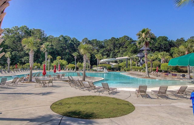 3331 Cottonfield Dr, Mount Pleasant, SC 29466 - community pool featuring view of wooded area, a patio area, and a water slide