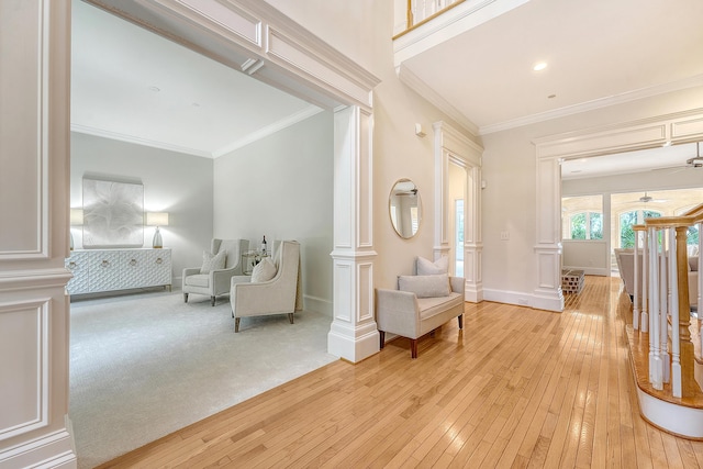 3331 Cottonfield Dr, Mount Pleasant, SC 29466 - living area with light wood-style flooring, ornate columns, a ceiling fan, crown molding, and recessed lighting