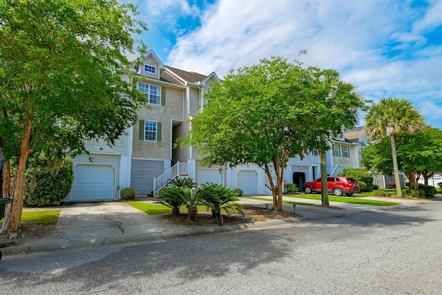 543 Mclernon Trce, Johns Island, SC 29455 - townhome / multi-family property featuring stairs, an attached garage, and driveway