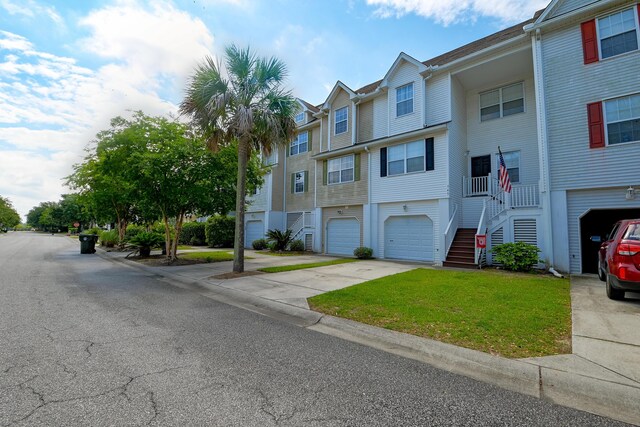 543 Mclernon Trce, Johns Island, SC 29455 - view of front of property featuring a garage, stairway, driveway, a residential view, and a front yard