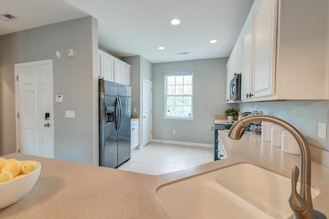 543 Mclernon Trce, Johns Island, SC 29455 - kitchen featuring stainless steel fridge with ice dispenser, a sink, light countertops, baseboards, and recessed lighting