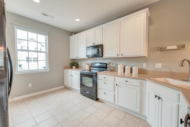 543 Mclernon Trce, Johns Island, SC 29455 - kitchen with black appliances, white cabinets, light countertops, recessed lighting, and a sink