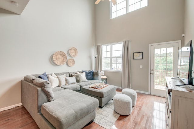 543 Mclernon Trce, Johns Island, SC 29455 - living area with a high ceiling, light wood-type flooring, baseboards, and a ceiling fan