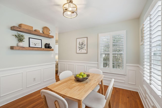 dining area with dark hardwood / wood-style flooring