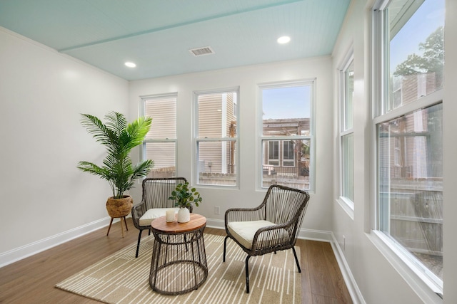 sitting room with dark wood-type flooring