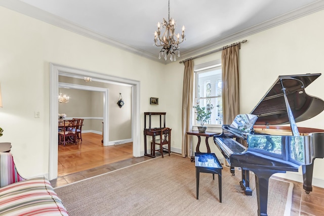 sitting room with baseboards, a chandelier, tile patterned flooring, and ornamental molding