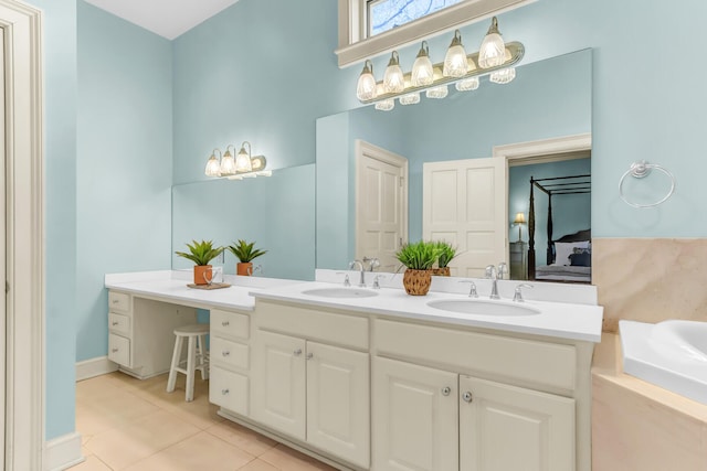 full bath featuring tile patterned flooring, double vanity, a bathtub, and a sink