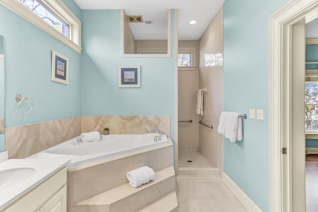 bathroom featuring tile patterned floors, tiled shower, plenty of natural light, and a bath