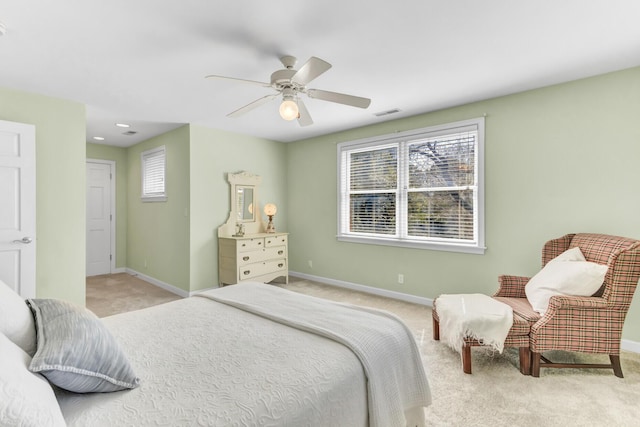 bedroom with multiple windows, baseboards, and carpet floors