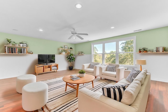 living room featuring visible vents, a ceiling fan, wood finished floors, recessed lighting, and baseboards