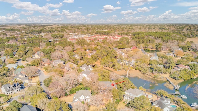 birds eye view of property featuring a residential view and a water view