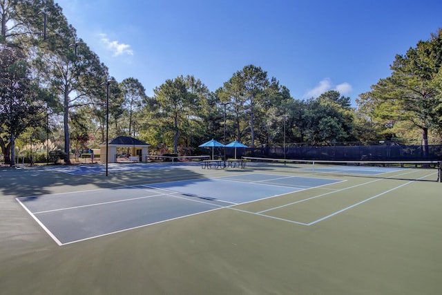 view of tennis court with fence