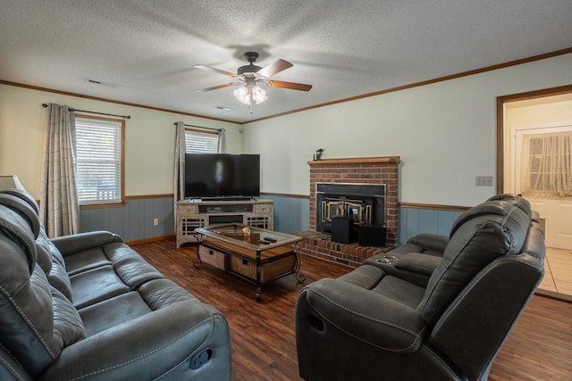 6427 Quimby Rd, Dalzell, SC 29040 - living room with wainscoting, wood finished floors, ceiling fan, crown molding, and a textured ceiling