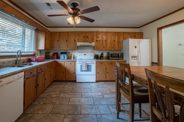 6427 Quimby Rd, Dalzell, SC 29040 - kitchen with white appliances, under cabinet range hood, a sink, brown cabinets, and ceiling fan