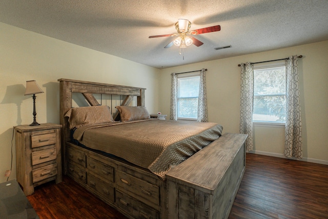 6427 Quimby Rd, Dalzell, SC 29040 - bedroom with dark wood-type flooring, a textured ceiling, a ceiling fan, and baseboards