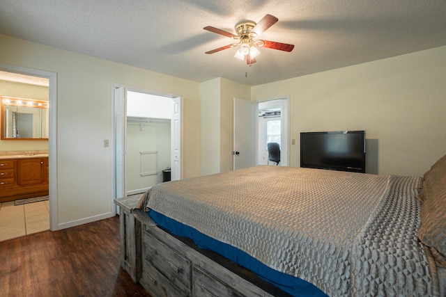 6427 Quimby Rd, Dalzell, SC 29040 - bedroom with dark wood finished floors, a sink, baseboards, ensuite bathroom, and a ceiling fan