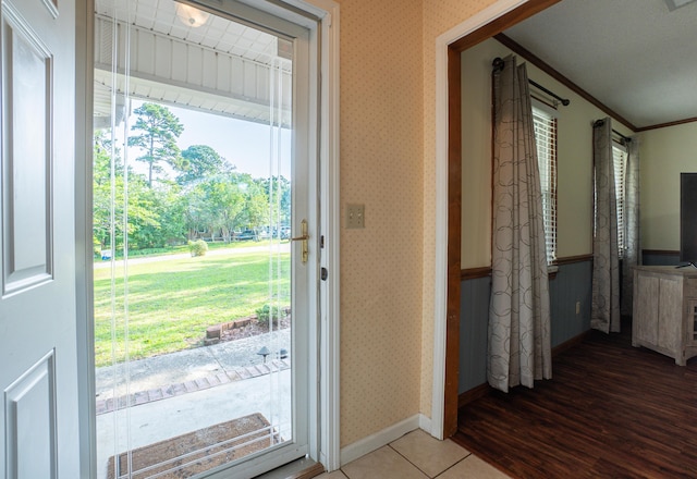 6427 Quimby Rd, Dalzell, SC 29040 - doorway to outside with ornamental molding, baseboards, wallpapered walls, and wood finished floors