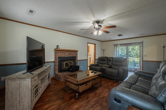 6427 Quimby Rd, Dalzell, SC 29040 - living room featuring dark wood-style floors, wainscoting, ceiling fan, a textured ceiling, and crown molding