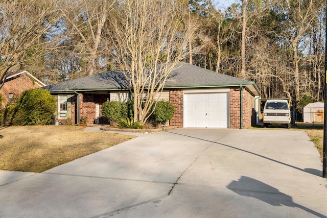 ranch-style home with driveway, brick siding, and an attached garage