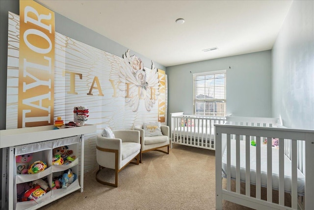 bedroom with carpet and a nursery area