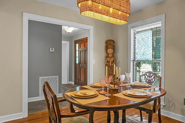 49 Crosscreek Dr, Charleston, SC 29412 - dining space featuring a chandelier, baseboards, and wood finished floors
