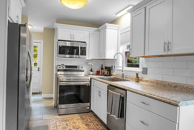 49 Crosscreek Dr, Charleston, SC 29412 - kitchen with appliances with stainless steel finishes, a sink, tasteful backsplash, and light countertops