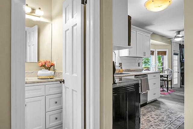 49 Crosscreek Dr, Charleston, SC 29412 - kitchen with light countertops, white cabinetry, ceiling fan, and tasteful backsplash