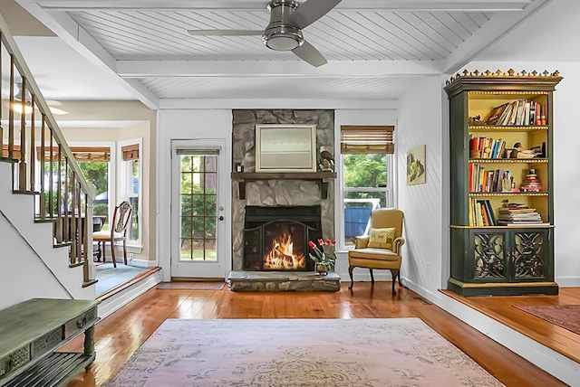 49 Crosscreek Dr, Charleston, SC 29412 - living area featuring beam ceiling, wood finished floors, ceiling fan, a fireplace, and stairs