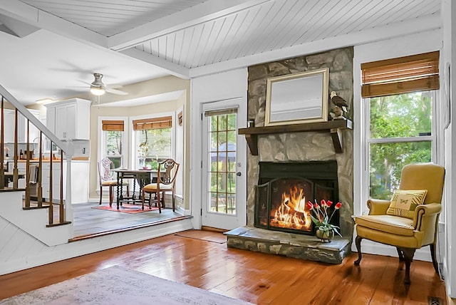 49 Crosscreek Dr, Charleston, SC 29412 - living room with stairway, wood finished floors, a fireplace, a ceiling fan, and beam ceiling