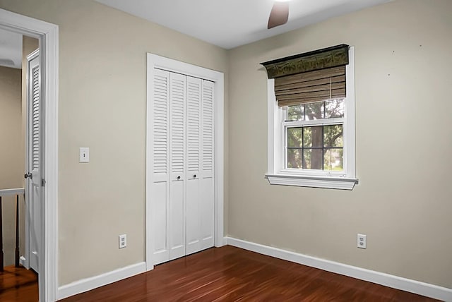49 Crosscreek Dr, Charleston, SC 29412 - unfurnished bedroom with baseboards, dark wood-type flooring, a closet, and ceiling fan