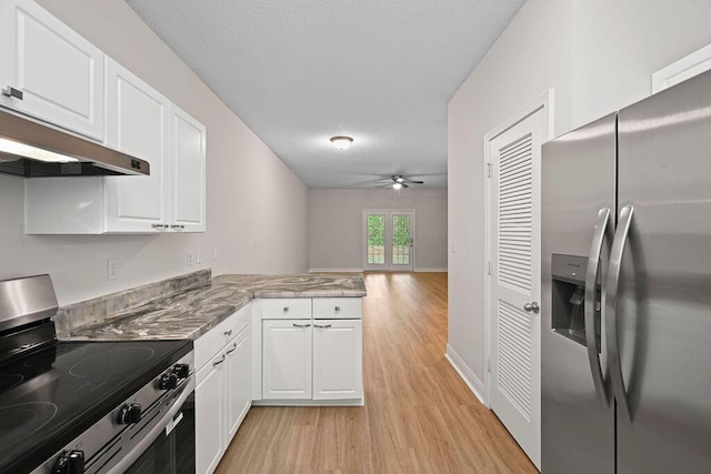 4591 Great Oak Dr, North Charleston, SC 29418 - kitchen with a peninsula, white cabinetry, under cabinet range hood, light wood-style flooring, and stainless steel appliances