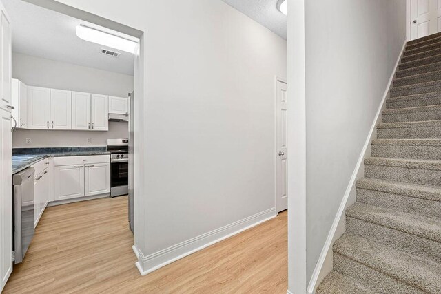 4591 Great Oak Dr, North Charleston, SC 29418 - stairway with baseboards, visible vents, and wood finished floors