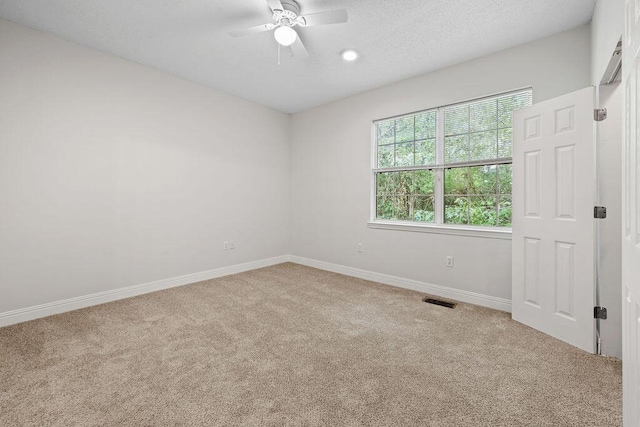 4591 Great Oak Dr, North Charleston, SC 29418 - carpeted spare room featuring baseboards, a ceiling fan, a textured ceiling, and visible vents