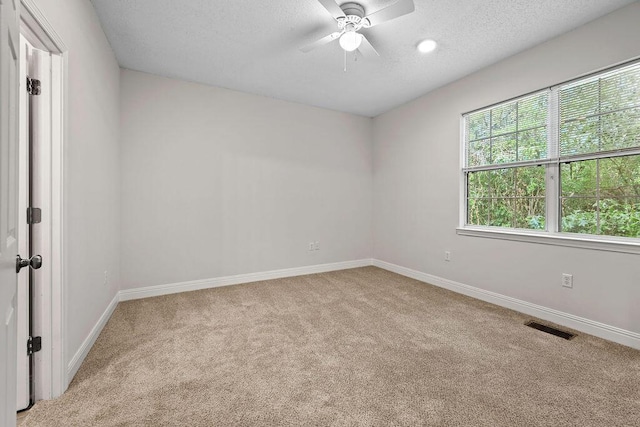 4591 Great Oak Dr, North Charleston, SC 29418 - carpeted empty room featuring a ceiling fan, a textured ceiling, visible vents, and baseboards