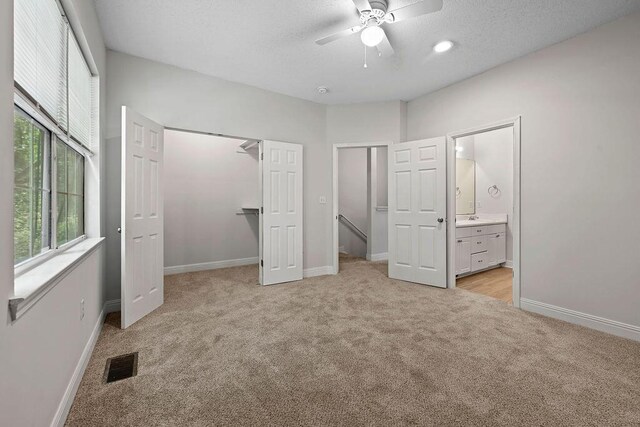 4591 Great Oak Dr, North Charleston, SC 29418 - unfurnished bedroom with connected bathroom, baseboards, visible vents, and light carpet