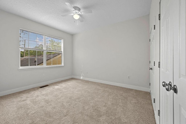 4591 Great Oak Dr, North Charleston, SC 29418 - carpeted spare room with visible vents, a ceiling fan, a textured ceiling, and baseboards