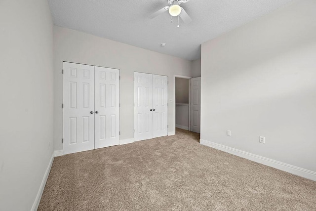 4591 Great Oak Dr, North Charleston, SC 29418 - unfurnished bedroom with baseboards, carpet flooring, and two closets