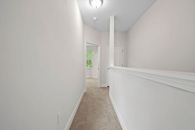 4591 Great Oak Dr, North Charleston, SC 29418 - corridor featuring baseboards, a textured ceiling, and light colored carpet
