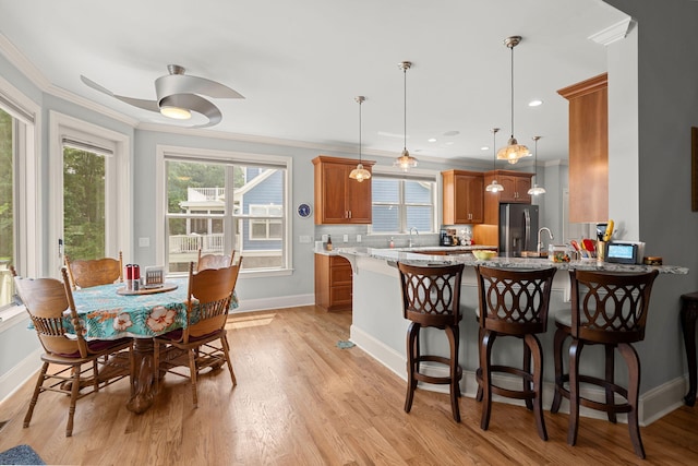 8605 Refuge Point Cir N, Charleston, SC 29420 - dining room with ornamental molding, baseboards, healthy amount of natural light, light wood-style flooring, and ceiling fan