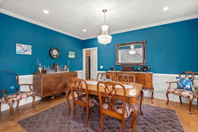 8605 Refuge Point Cir N, Charleston, SC 29420 - dining space featuring wainscoting, ornamental molding, wood finished floors, recessed lighting, and a chandelier